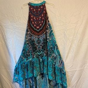 High-low colorful, sleeveless dress, free and flowing, very comfortable.